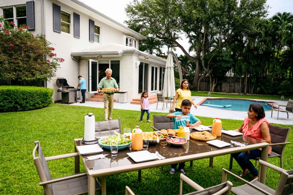 A florida family enjoying a backyard meal.