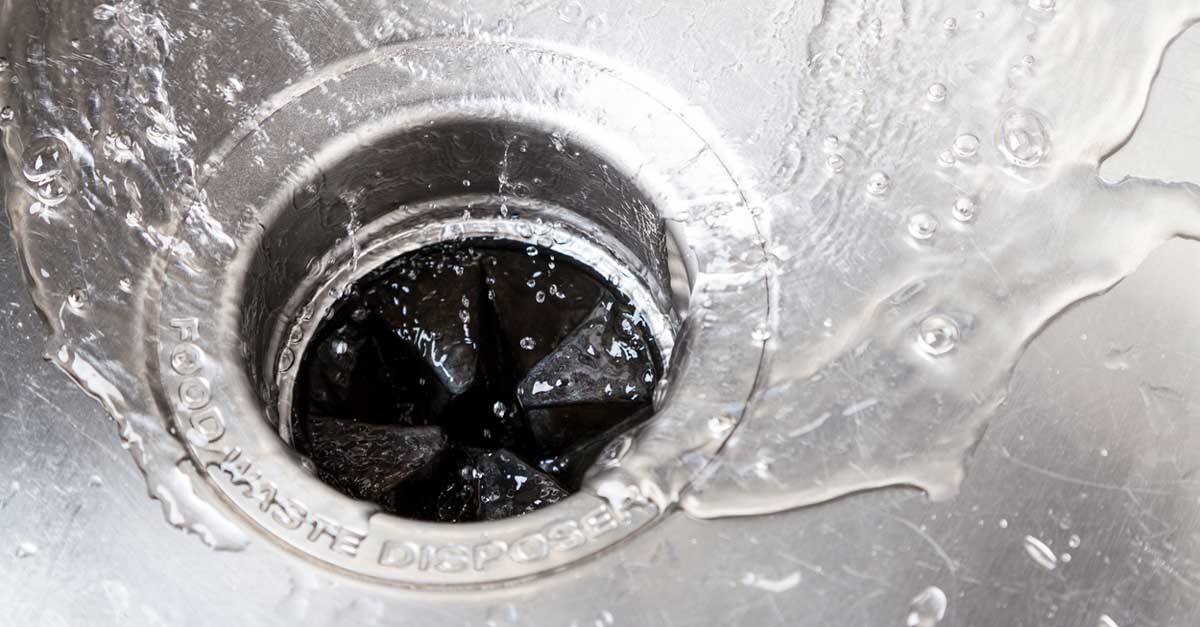 Closeup of kitchen sink with garbage disposal