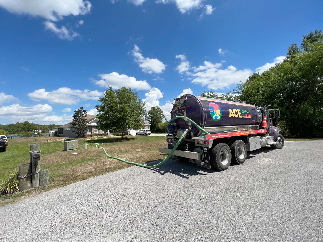 Photo of septic pump truck against blue sky