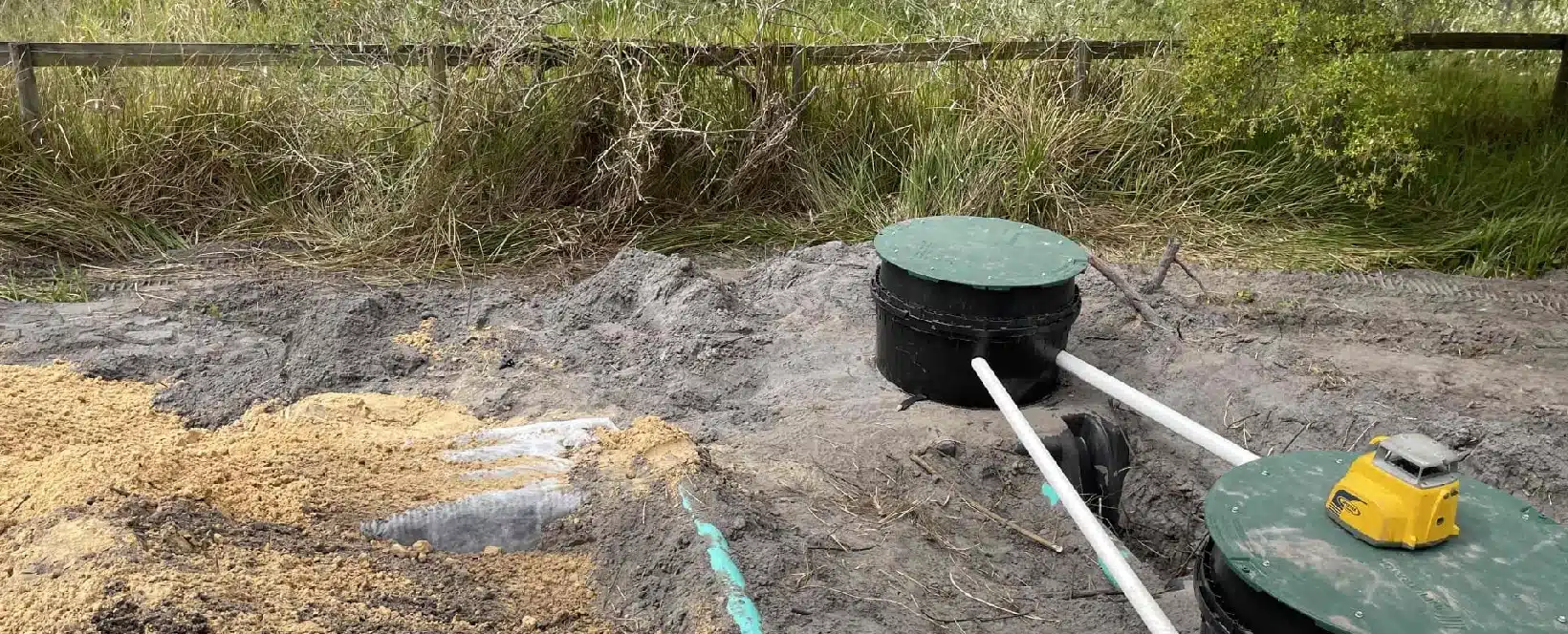 A septic tank riser installed on a buried septic tank