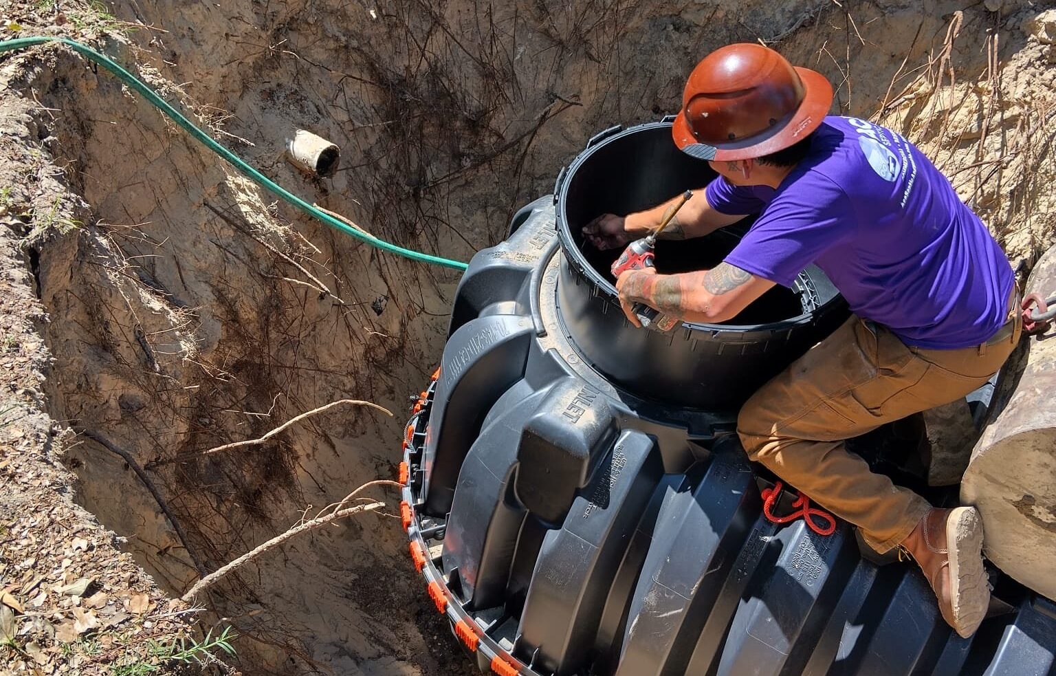 A technician installing a septic tank after getting the septic permit.