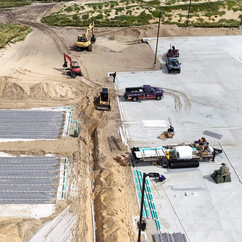 An aerial view of a commercial septic system installation with multiple drain fields.